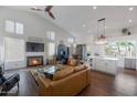 Open living space with a modern kitchen, island, and vaulted ceiling at 12056 E Bella Vista Cir, Scottsdale, AZ 85259