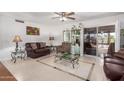 Spacious living room featuring tile floors and sliding glass doors at 12059 S Paiute St, Phoenix, AZ 85044