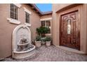 Front courtyard with fountain and brick pavers at 12061 W Miner Trl, Peoria, AZ 85383