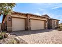 Three-car garage with paver driveway at 12061 W Miner Trl, Peoria, AZ 85383