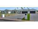 Modern home exterior, gray roof, white walls, and a paved driveway at 12075 N 76Th Ct, Scottsdale, AZ 85260