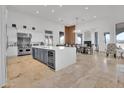 Gourmet kitchen with island, stainless steel appliances, and white cabinetry at 13648 E Aloe Vera Dr, Scottsdale, AZ 85262