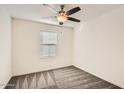 Bright bedroom with carpeted floors and window blinds at 14238 W Bronco Trl, Surprise, AZ 85387