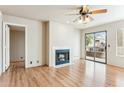 Living room with fireplace and sliding doors to patio at 14645 N Fountain Hills Blvd # 217, Fountain Hills, AZ 85268