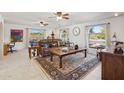 Spacious living room with tiled floors, southwestern decor, and ample natural light at 16837 E Lunar Ln, Fountain Hills, AZ 85268