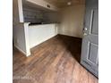 Kitchen with a breakfast bar and simple cabinetry at 18202 N Cave Creek Rd # 108, Phoenix, AZ 85032