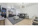 Modern living room featuring a cozy fireplace and stylish furniture at 19777 N 76Th St # 2263, Scottsdale, AZ 85255