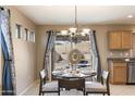 Bright dining area with table for four and view of backyard at 23618 W Adams St, Buckeye, AZ 85396