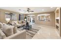 Spacious living room with beige sofas and decorative rug at 23618 W Adams St, Buckeye, AZ 85396