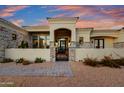 Elegant entry with iron gate & stonework at 27931 N Montana Dr, Rio Verde, AZ 85263