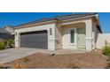 New single-story home with a two-car garage and desert landscaping at 3210 W Stradling Ave, Apache Junction, AZ 85120