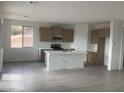 Modern kitchen featuring island and light wood cabinets at 35810 E Montello Pl, Scottsdale, AZ 85262