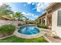 Stunning kidney-shaped pool with surrounding patio and lush landscaping at 4543 E Molly Ln, Cave Creek, AZ 85331