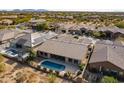 Aerial home view, showcasing pool and solar panels at 5626 E Sleepy Ranch Rd, Cave Creek, AZ 85331