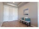 Welcoming foyer features tile flooring, a bench with pillows, and a decorative painting at 5626 E Sleepy Ranch Rd, Cave Creek, AZ 85331