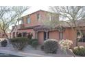 Spanish style home with stucco walls, tile roof and mature landscaping at 7701 E Golden Eagle E Cir, Gold Canyon, AZ 85118