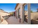 Private patio with wrought iron furniture and terracotta pots at 7701 E Golden Eagle E Cir, Gold Canyon, AZ 85118