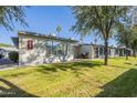 Exterior view of the property, showcasing its landscaping and building design at 7950 E Keats Ave # 170, Mesa, AZ 85209