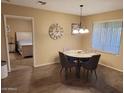 Small dining area with four chairs, adjacent to bedroom and kitchen at 8020 E Keats Ave # 314, Mesa, AZ 85209