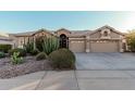 Single-story house with desert landscaping and a two-car garage at 9345 E Hobart St, Mesa, AZ 85207