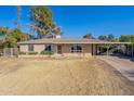 House with a large yard and carport at 1019 E Belmont Ave, Phoenix, AZ 85020