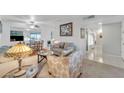 Bright living room with comfy seating and a dining area at 10314 W Sun City Blvd, Sun City, AZ 85351