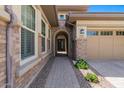 Brick walkway leads to a charming arched entryway at 10315 E Palladium Dr, Mesa, AZ 85212