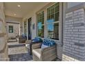 Front porch with wicker chairs and blue pillows at 1115 E Gleneagle St, Chandler, AZ 85249