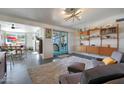 Bright living room with mid-century modern furniture and view of dining area at 1125 E Northview Ave, Phoenix, AZ 85020