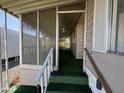 Screened porch with artificial turf and ceiling fan at 11411 N 91St Ave # 221, Peoria, AZ 85345