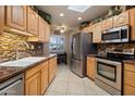 Well-equipped kitchen featuring stainless steel appliances and granite countertops at 13606 N 108Th Dr, Sun City, AZ 85351