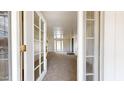 Bright entryway with a view into a carpeted living area at 143 N 88Th Pl, Mesa, AZ 85207