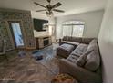 Bright living room featuring an L-shaped sofa and access to a patio at 15095 N Thompson Peak Pkwy # 1047, Scottsdale, AZ 85260