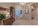 Bright and spacious entryway with tile floors and decorative accents at 16169 W Fairmount Ave, Goodyear, AZ 85395