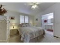 Main bedroom with a queen bed and en-suite bathroom access at 17200 W Bell Rd # 2255, Surprise, AZ 85374