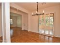 Spacious dining room with hardwood floors and a chandelier at 20704 N 90Th Pl # 1008, Scottsdale, AZ 85255