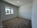 Cozy bedroom featuring carpet flooring and a bright window at 22852 E Lords Way, Queen Creek, AZ 85142