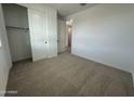 Bright bedroom with a closet, neutral walls, and carpeted floors, providing a cozy feel at 22852 E Lords Way, Queen Creek, AZ 85142