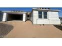 New construction home exterior showcasing a two-car garage and desert landscaping at 2674 E Abe Truckle Ave, San Tan Valley, AZ 85140