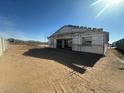 Rear view of a new home under construction with scaffolding at 2674 E Abe Truckle Ave, San Tan Valley, AZ 85140