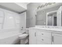 Clean bathroom with white vanity, marble countertop, and shower/tub combo at 2847 N 46Th Ave # 8, Phoenix, AZ 85035