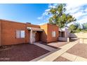 Two light brown stucco houses side by side with walkways at 2847 N 46Th Ave # 8, Phoenix, AZ 85035