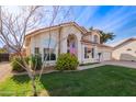 Two-story house with a landscaped lawn, attached garage, and neutral color scheme at 3124 N Sage Cir, Avondale, AZ 85392