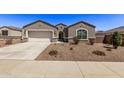 Single-story home with a two-car garage and desert landscaping at 3317 N 300Th Dr, Buckeye, AZ 85396
