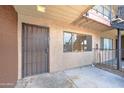 Private condo entrance with security gate and window at 3810 N Maryvale Pkwy # 1060, Phoenix, AZ 85031