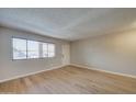 Bright living room featuring hardwood floors and an open layout at 3810 N Maryvale Pkwy # 1060, Phoenix, AZ 85031