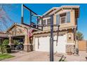 Two-story house with a large front yard, basketball hoop, and two-car garage at 4058 E Mesquite St, Gilbert, AZ 85296