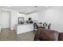 Modern kitchen with white cabinets and granite counters at 4130 E Pinto Dr, Gilbert, AZ 85296