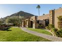 Landscaped front yard with walkway leading to home entrance at 4836 E Moonlight Way, Paradise Valley, AZ 85253