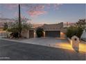 Inviting stucco home with a two-car garage and landscaped yard at 5028 N Scottsdale Rd, Paradise Valley, AZ 85253